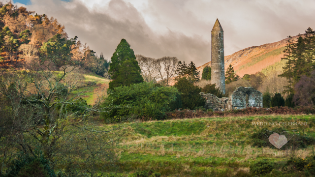 Irish countryside with ancient stone tower and lush greenery